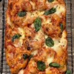 Slice of Margherita Pizza Focaccia topped with fresh mozzarella and basil