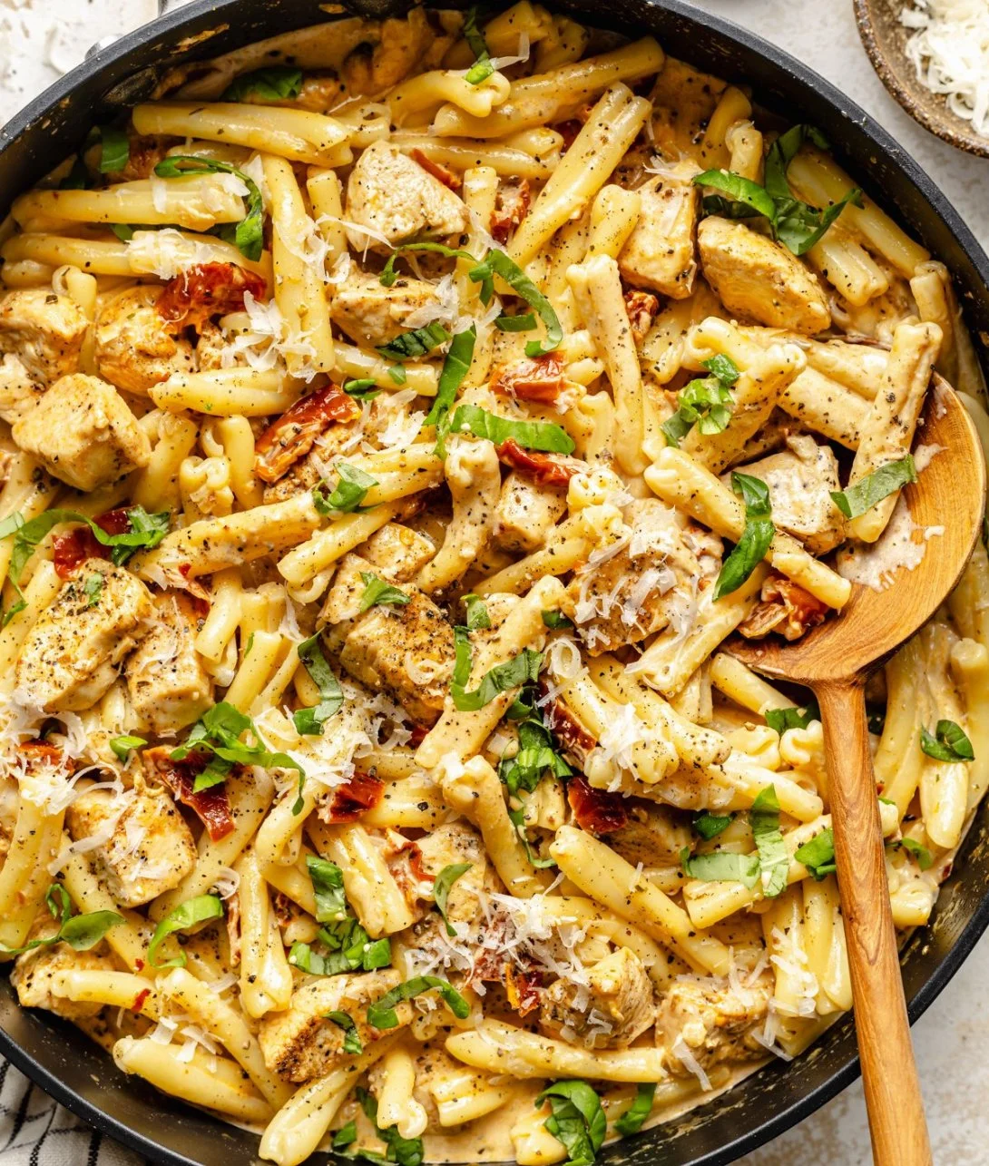 Delicious Marry Me Chicken Pasta served in a bowl, garnished with fresh herbs.