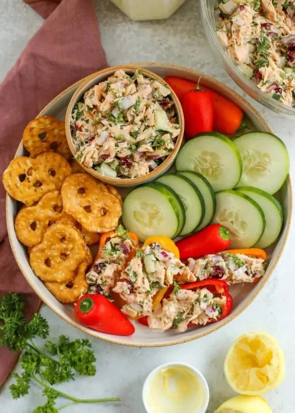Meal prep salmon salad with fresh ingredients in a bowl