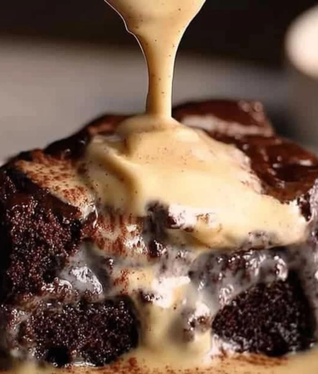 Slice of Mexican Chocolate Milk Cake topped with chocolate icing