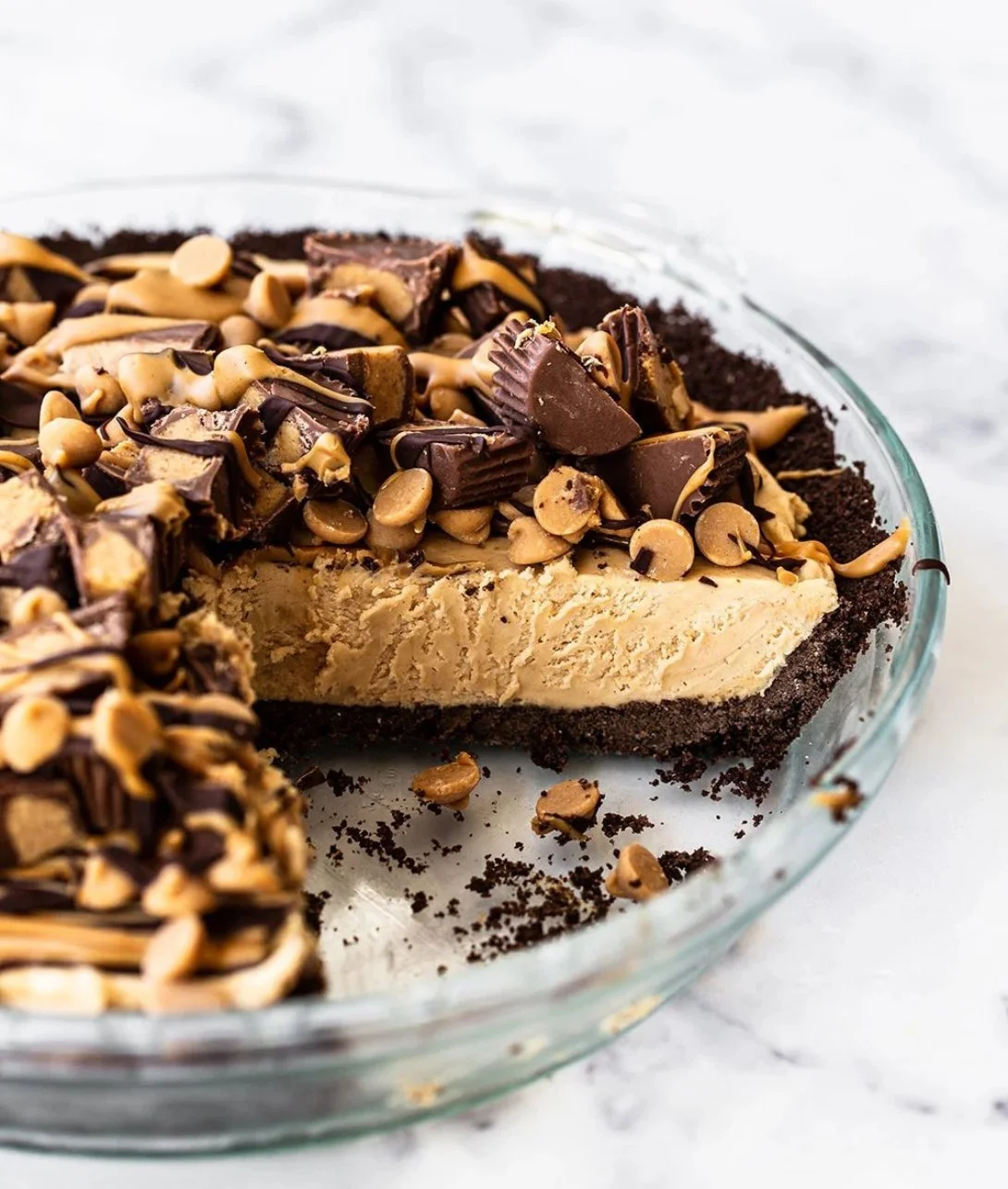 Deliciously layered Peanut Butter Pie with chocolate topping and whipped cream.