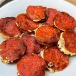Savory pepperoni pockets filled with cheese and spices, perfect for snacks.