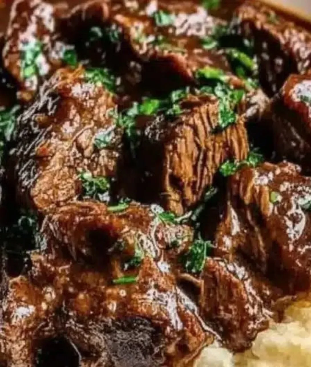 Slow Cooker Beef Manhattan dish with tender beef and rich gravy