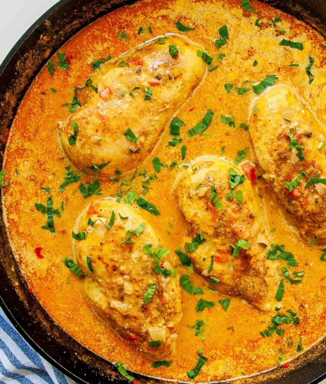 Delicious Spicy Brazilian Coconut Chicken served with colorful vegetables