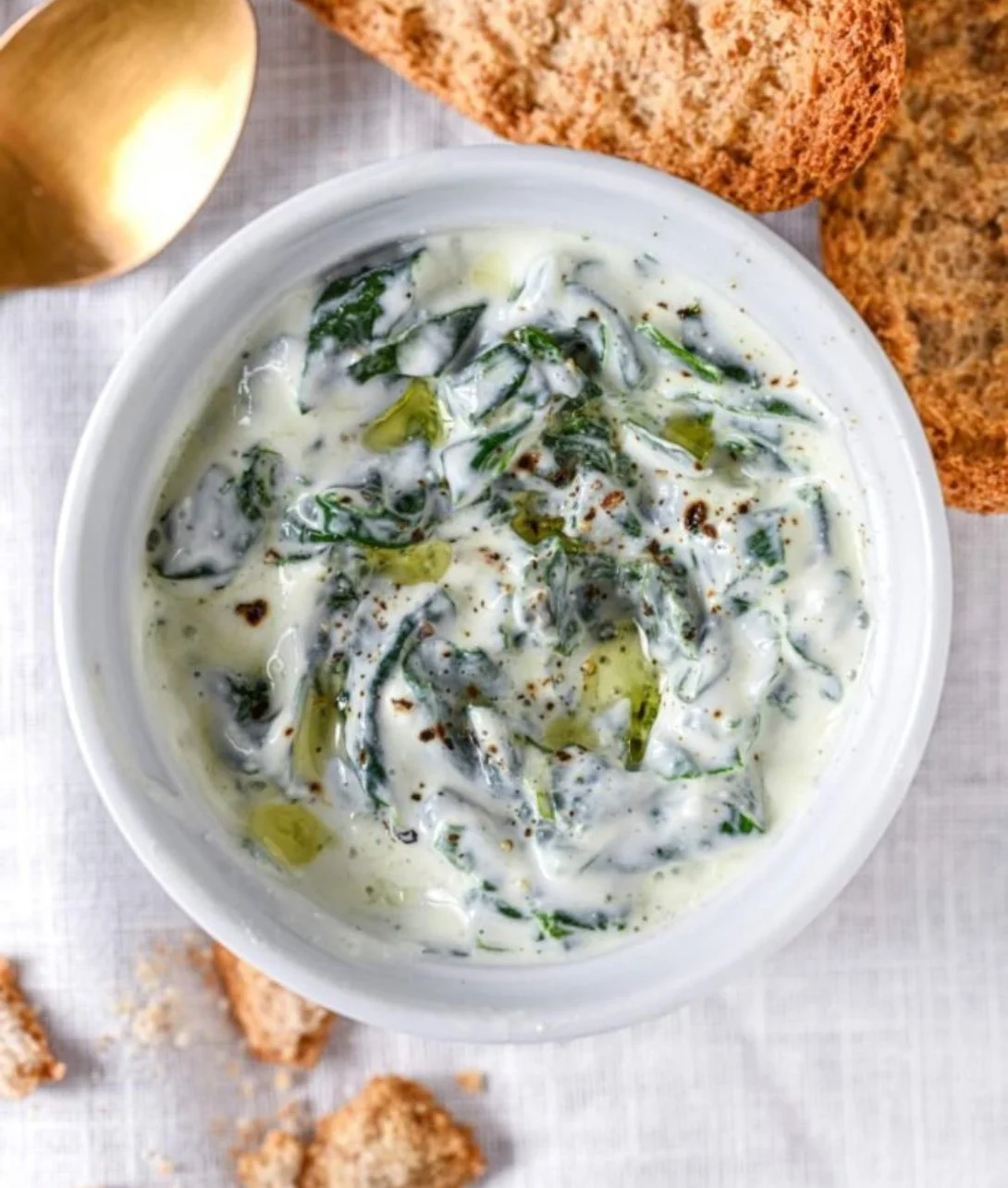 Delicious homemade spinach dip served in a bowl with fresh vegetables