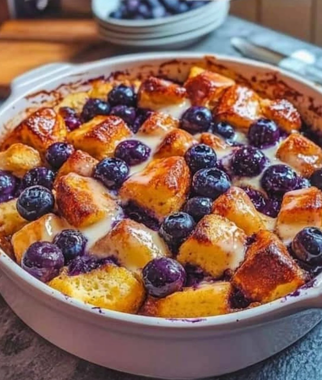 Vegan blueberry french toast casserole served with fresh blueberries
