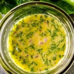 Zesty lemon dill vinaigrette drizzled over a fresh salad