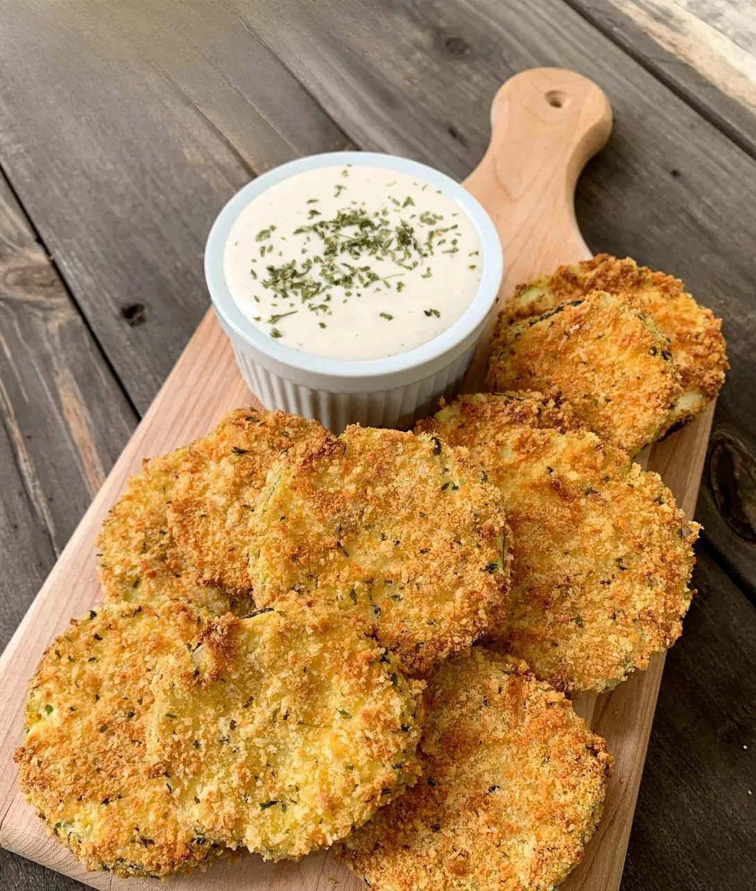 Crispy zucchini chips made in an air fryer, a healthy snack option.