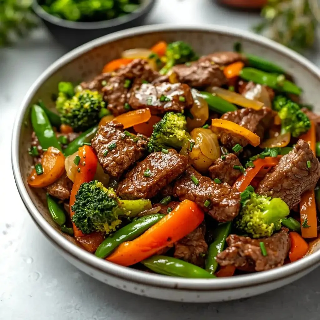 Beef stir-fry with colorful mixed vegetables served in a bowl