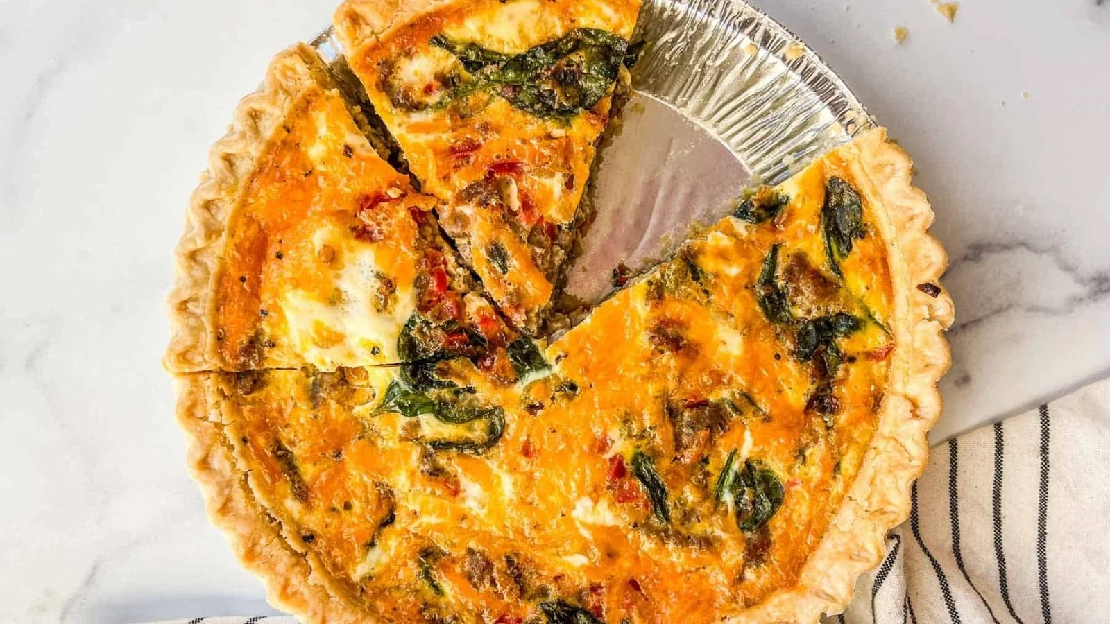 Delicious homemade breakfast quiche with vegetables and cheese