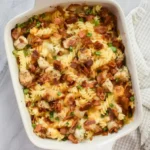 Delicious Chicken Bacon Ranch Casserole topped with crispy bacon and cheese.