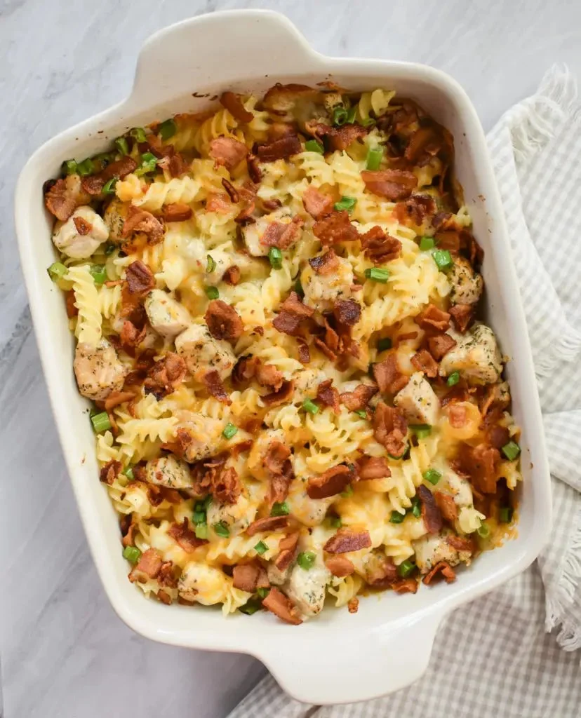 Delicious Chicken Bacon Ranch Casserole topped with crispy bacon and cheese.