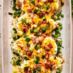 Delicious Crack Chicken Bake topped with cheese and herbs ready to serve.