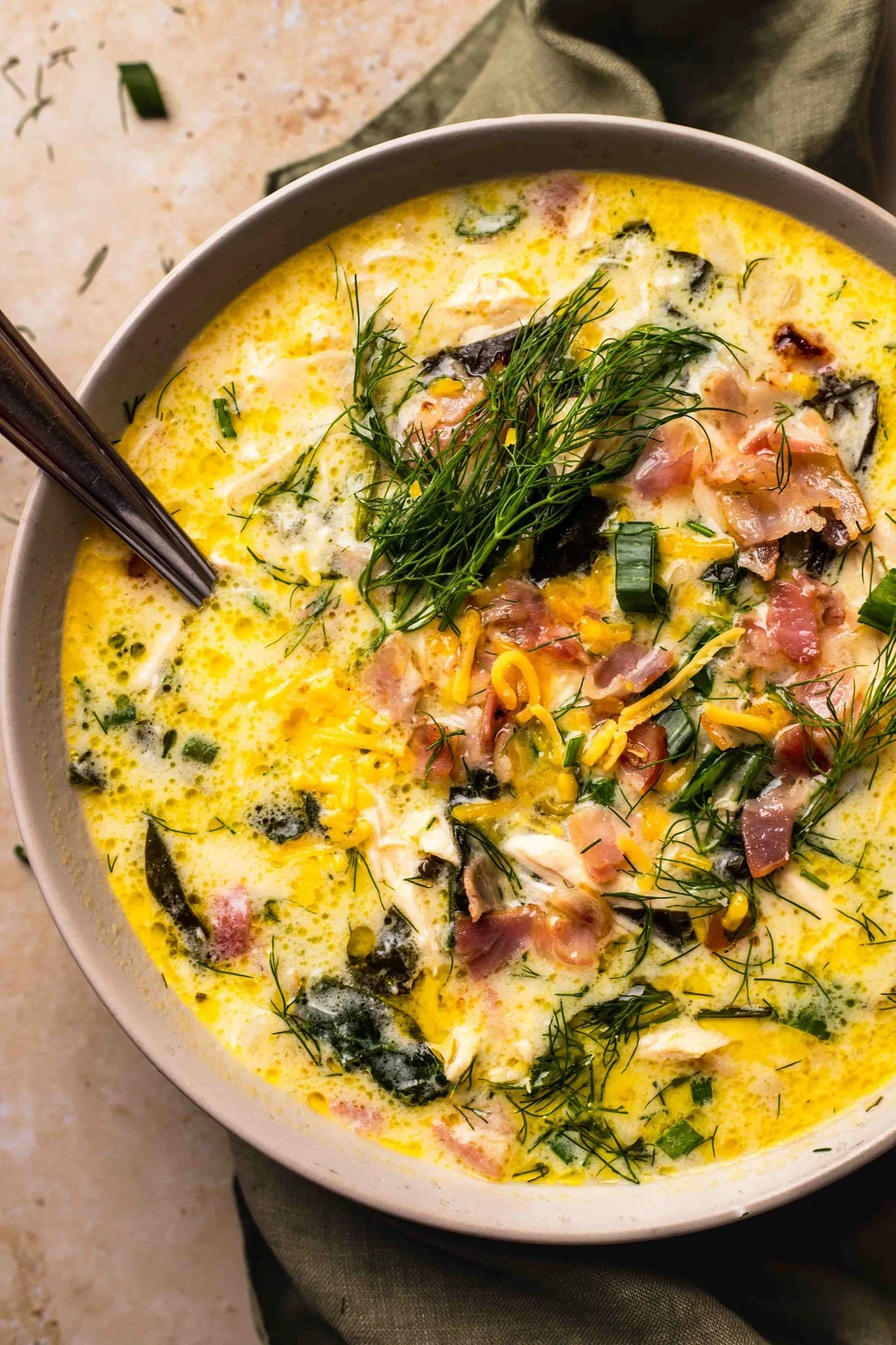 Delicious creamy Crack Chicken Soup in a bowl garnished with herbs