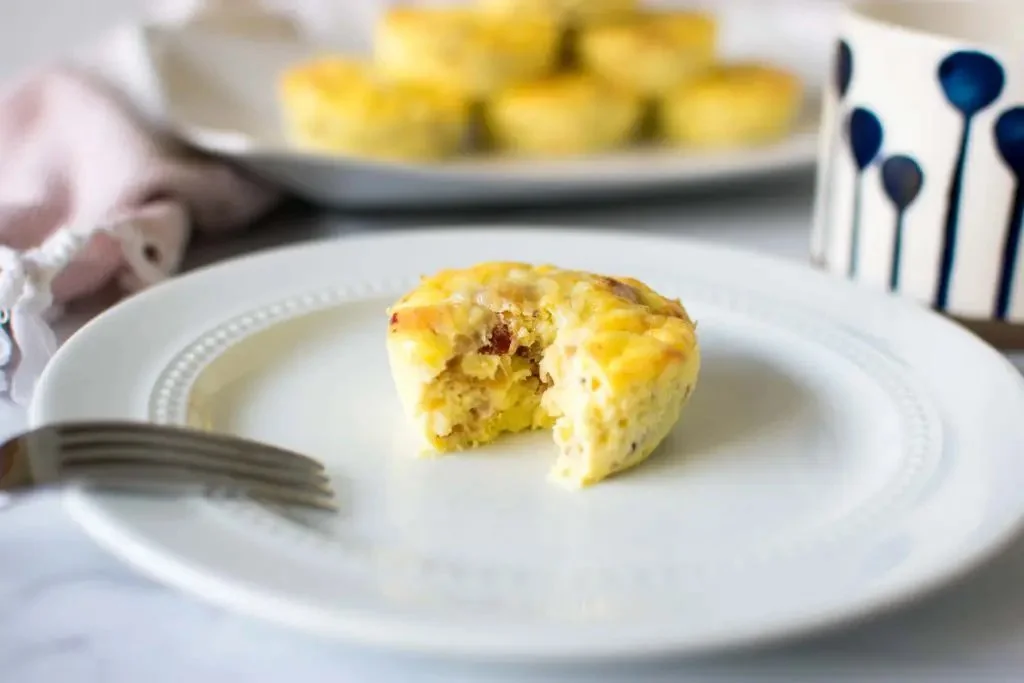 Delicious easy bacon gruyere egg bites in a muffin tin ready to serve.