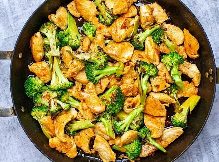 Delicious chicken broccoli stir-fry on a plate with vibrant vegetables