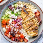 Delicious Greek Chicken Bowl with fresh vegetables and grilled chicken
