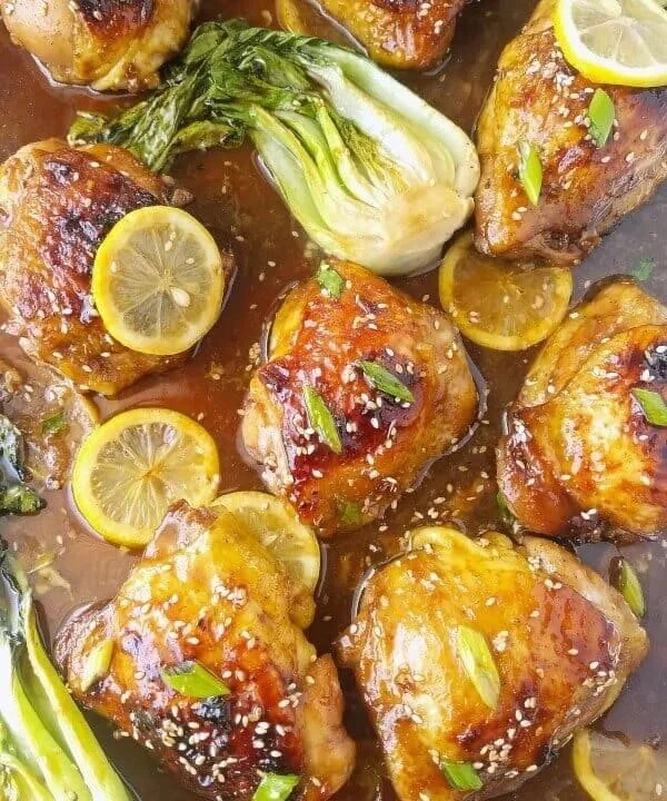 Delicious plate of honey soy chicken garnished with spring onions.