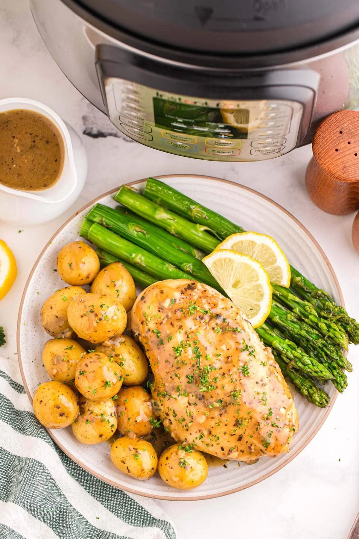 Instant Pot Lemon Garlic Chicken served with potatoes