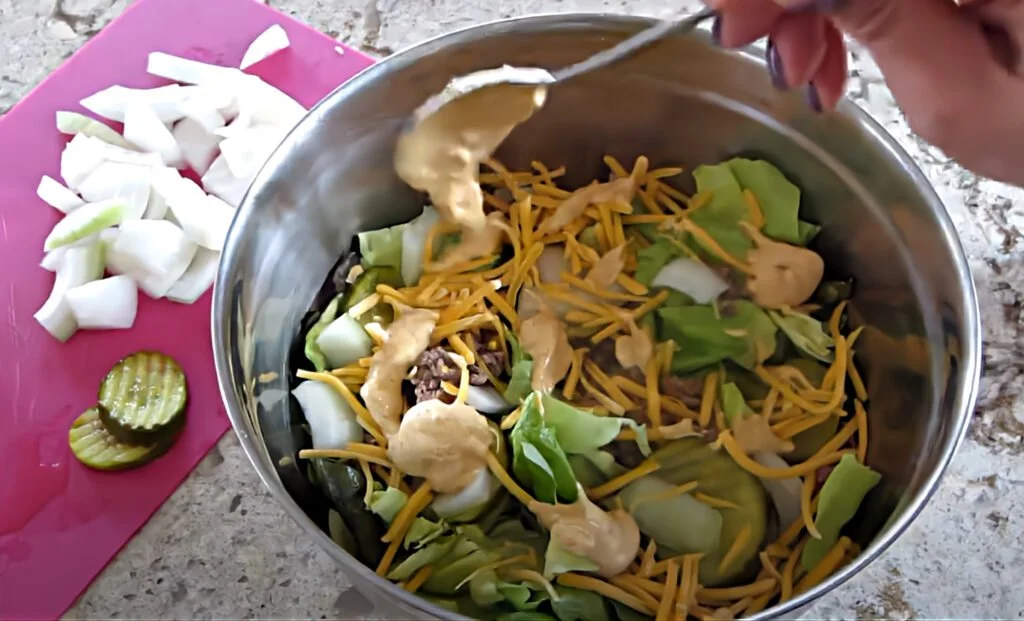 Delicious Keto Big Mac Salad featuring lettuce, cheese, and special sauce.