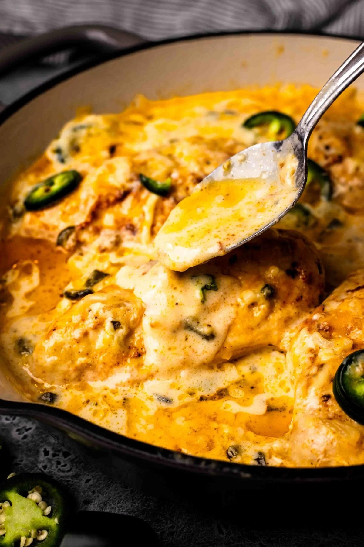 One-Pan Cheesy Jalapeno Chicken garnished with jalapenos and cheese.