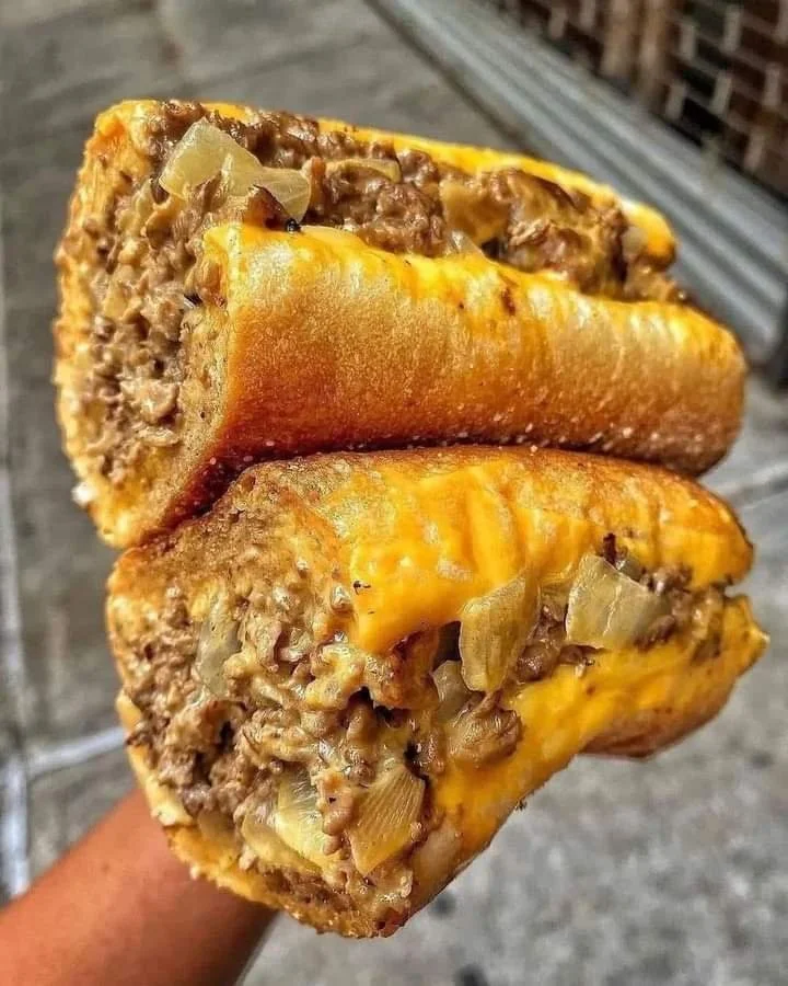 Philly Cheese Steak Sloppy Joes on a plate with toppings