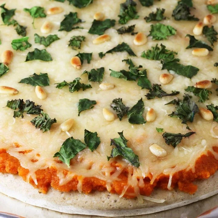 Delicious homemade Pumpkin Kale Pizza topped with fresh ingredients