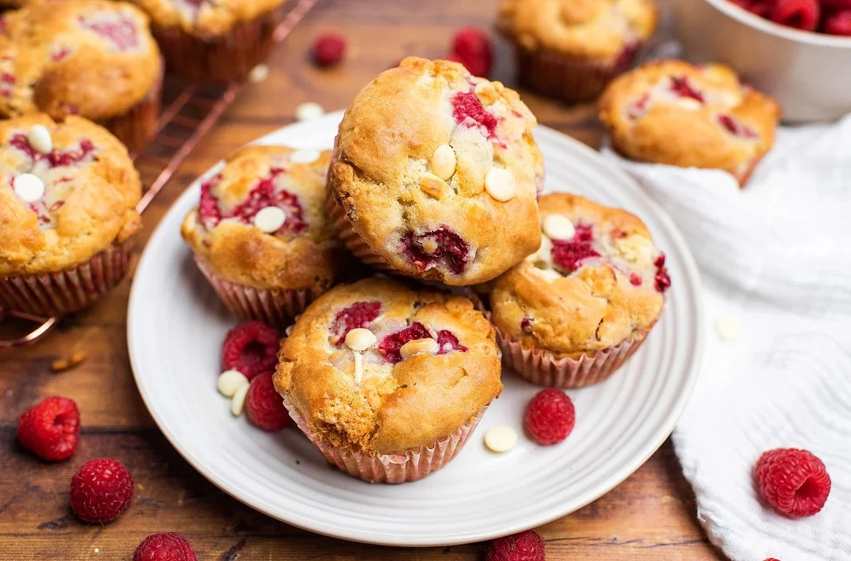 Delicious homemade Raspberry White Chocolate Muffins with fresh raspberries and white chocolate chunks