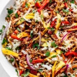 Colorful Thai Mango Chicken Salad with fresh greens, mango, and chicken