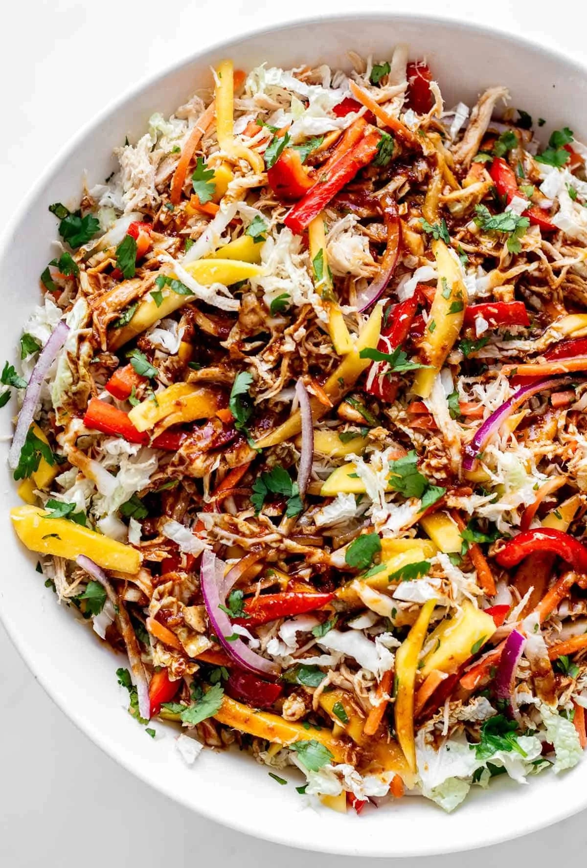 Colorful Thai Mango Chicken Salad with fresh greens, mango, and chicken
