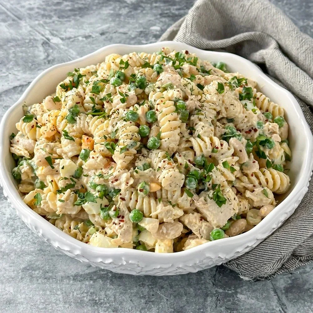 Delicious tuna pasta salad served in a bowl with fresh vegetables
