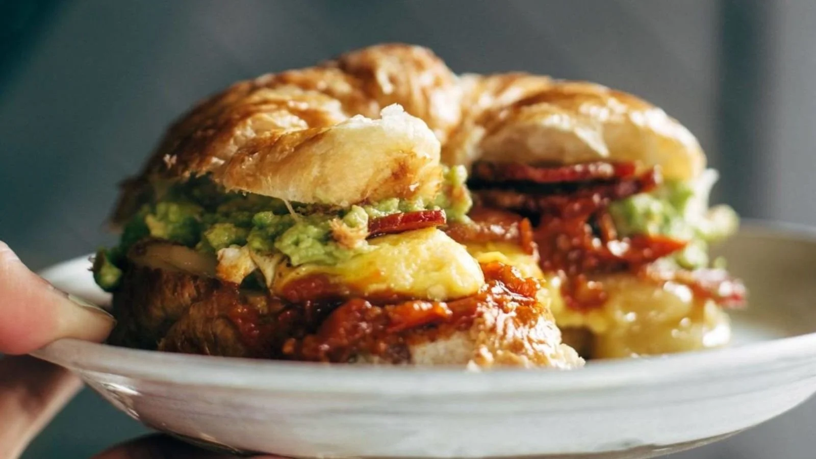 Ultimate breakfast sandwich with eggs, cheese, and bacon on a toasted bun